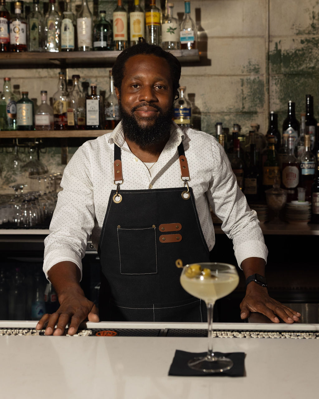 Daniel presenting a signature red cocktail